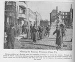 Russian POWs Sweep a Street in Russian Poland