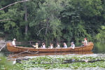 Reenactors Riding in a Canoe by Sue Reichert