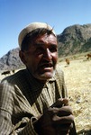 Farmer discussing grain tax with community leader in a village in Boir Ahmad by Reinhold Loeffler