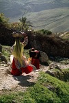 Women carrying washing and water in Boir Ahmad by Reinhold Loeffler