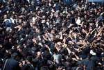 Mourners at funeral of Ayatollah Khomeni by Reinhold Loeffler