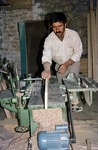 Carpenter working with modern machines by Reinhold Loeffler