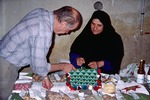 Woman explaining the handicrafts business she set up for local women in Boir Ahmad by Reinhold Loeffler