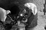 Women cooking, Boir Ahmad village by Reinhold Loeffler