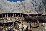 Homes at a herding outpost with livestock corral in Boir Ahmad