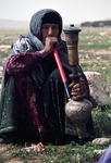 Woman smoking a water pipe in Boir Ahmad