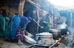 Women cooking for wedding by Reinhold Loeffler